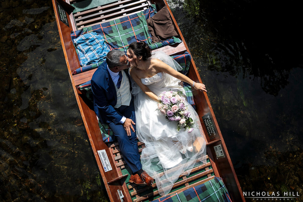 A couple just married are wedding punting